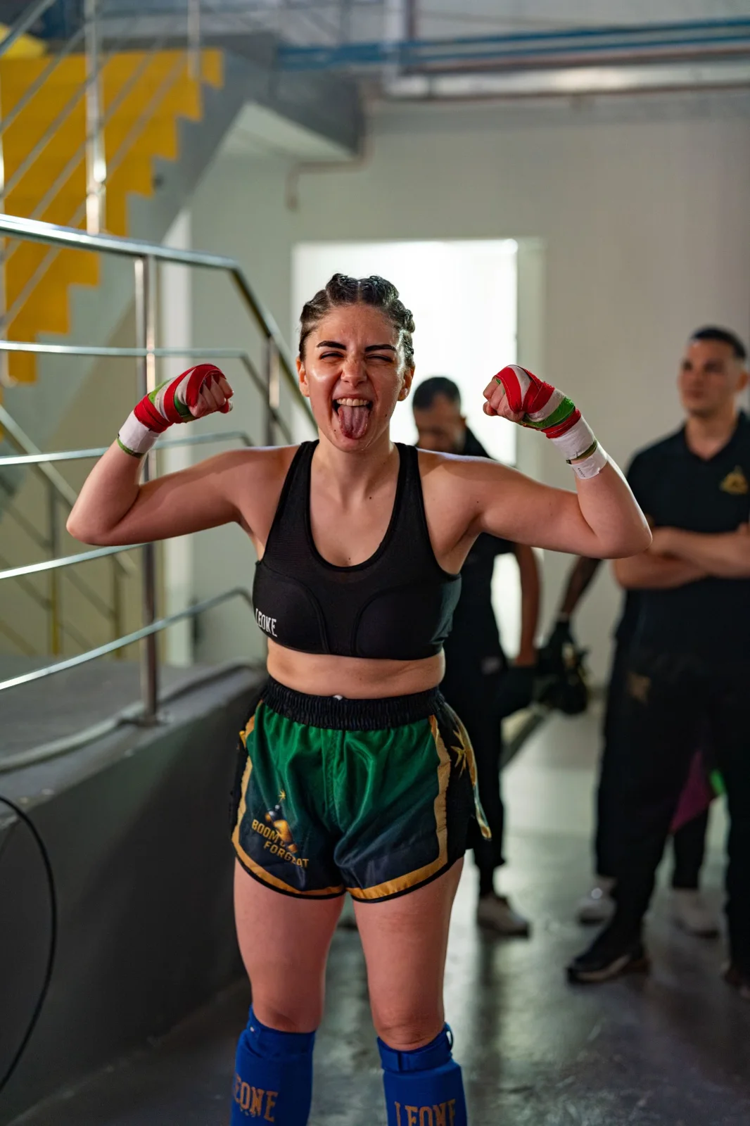 Fighter in gloves smiling ringside